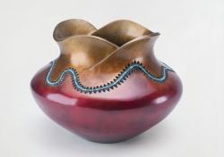 Bronze jar with turquoise bead inlay
