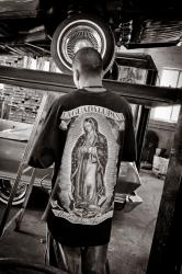 Mechanic in Ray’s Garage, Chimayó in Con Cariño: Artists Inspired by Lowriders