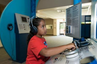 30 NMMNHS 2017 Child with headsets on at Wild Music Exhibiton