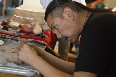 2-MOIFA-Gallery of Conscience: Wayland Sanchez sculpting his clay piece during a healing pottery workshop at Elder Kathy Wan Povi Sanchez house, San Ildefonso Pueblo, April 10th, 2018    Photographer: Chloe Accardi 